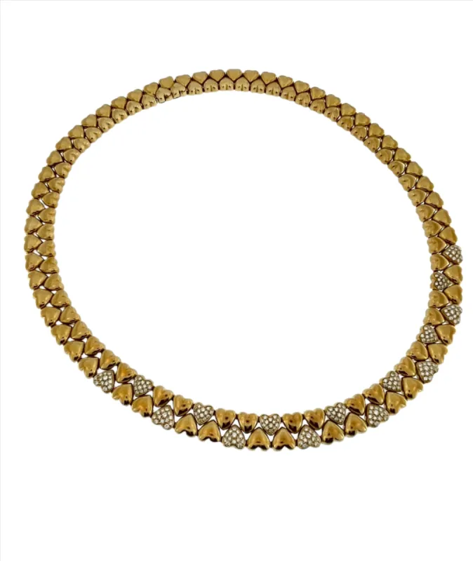 Cartier - Collier Double Cœur en or jaune et diamants sold by 58 Facettes