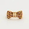 Bague Nœud Diamants et Rubis sold by 58 Facettes