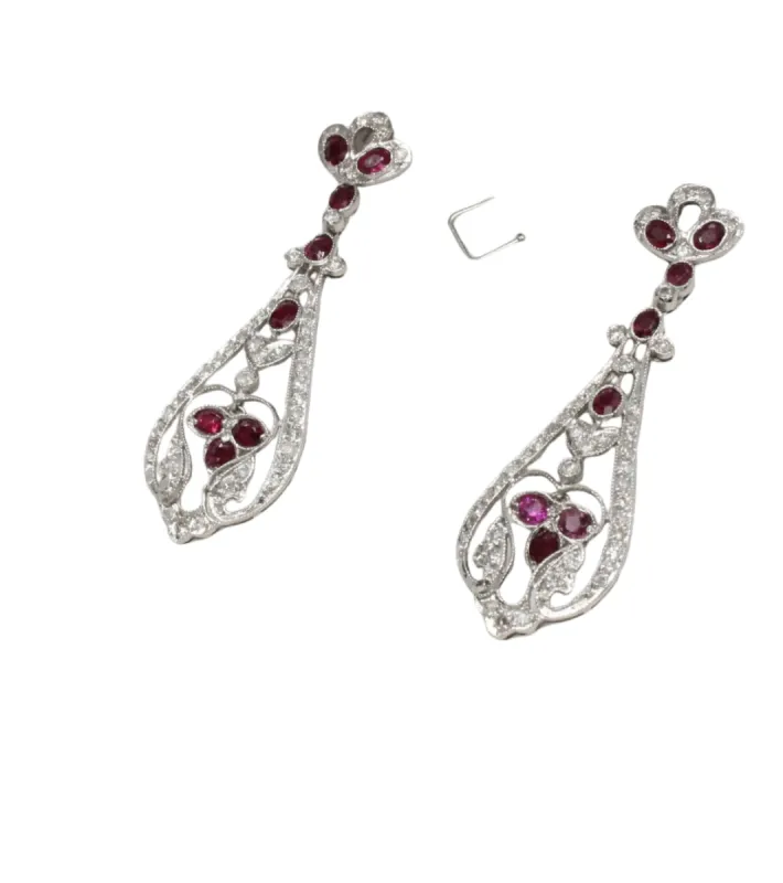 Art deco style earrings in platinum with diamonds and rubies. sold by 58 Facettes
