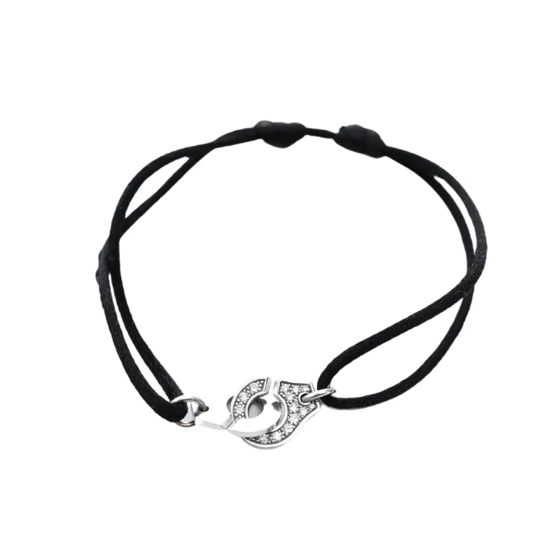 DINH VAN - Bracelet Menottes R10 or blanc, cordon noir et diamants sold by 58 Facettes
