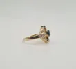 Bague or jaune sertie de diamants et d'un saphir sold by 58 Facettes