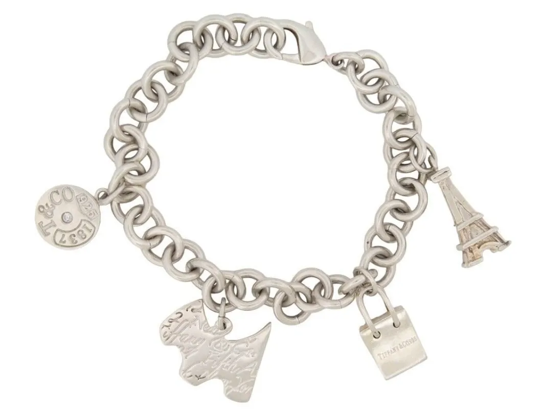 bracelet TIFFANY & CO chaine a breloques charms tour eiffel en argent sold by 58 Facettes