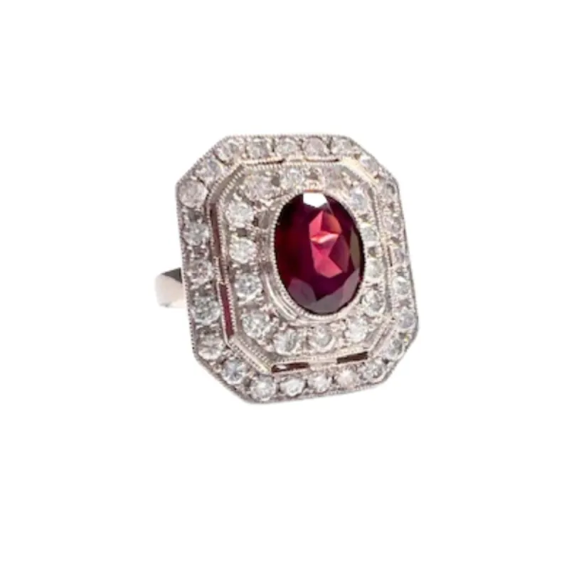 Bague en platine de style Art Déco avec diamants et grenat sold by 58 Facettes