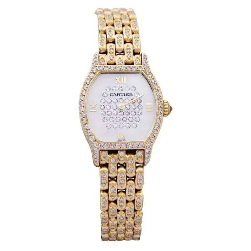 Montre Cartier "Tortue" or jaune, diamants, nacre. sold by 58 Facettes