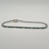 Rivière or blanc sertie de diamants et émeraudes sold by 58 Facettes