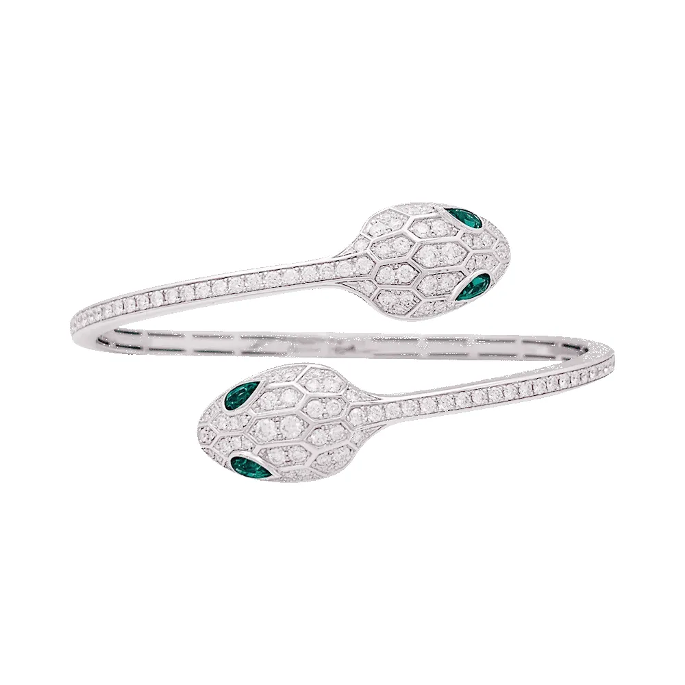 Bracelet Bulgari "Serpenti Seduttori" or blanc, diamants, émeraudes. sold by 58 Facettes
