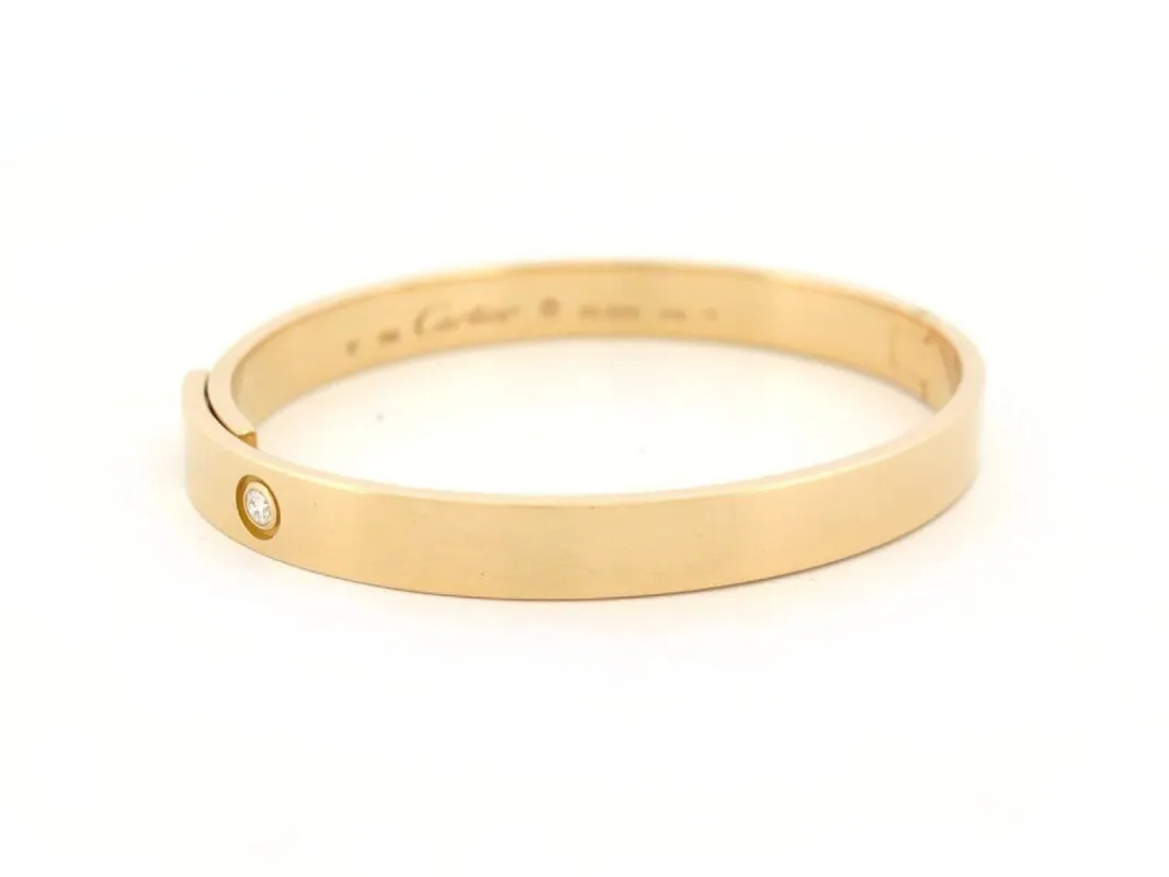 bracelet CARTIER jonc love anniversary t17 or jaune diamant solitaire 40gr sold by 58 Facettes