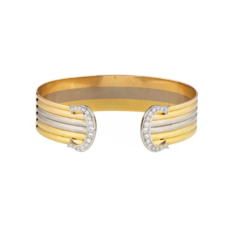 Bracelet Cartier Double C en diamants et trois manchettes en or des années 1980, bijoux fins vintage sold by 58 Facettes