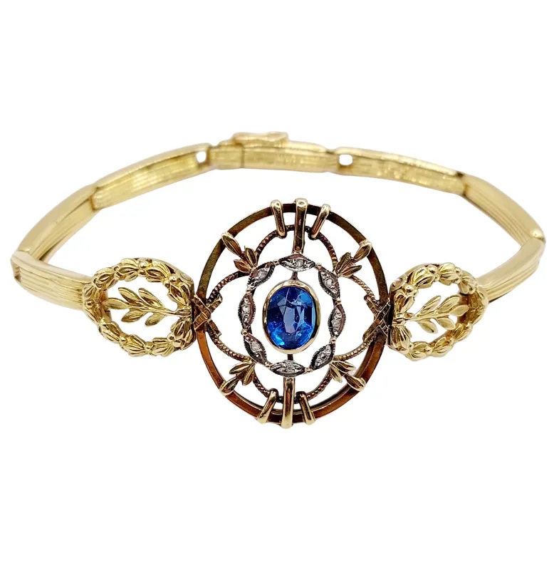 Bracelet art nouveau or jaune orné d'une pierre bleue et de diamants taille roses entouré de décorations fleuries sold by 58 Facettes