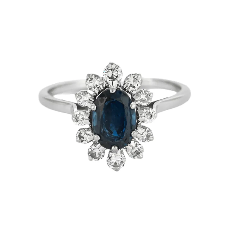 Bague Marguerite or gris 18K (750 Millièmes) sertie d’un saphir et entouré de diamants sold by 58 Facettes