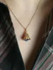 Pendentif charms vintage cloche or jaune pierre bleue sold by 58 Facettes