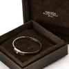 HERMES - Kelly - Petit modèle - Bracelet en or gris et diamants sold by 58 Facettes