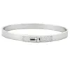 HERMES - Kelly - Petit modèle - Bracelet en or gris et diamants sold by 58 Facettes