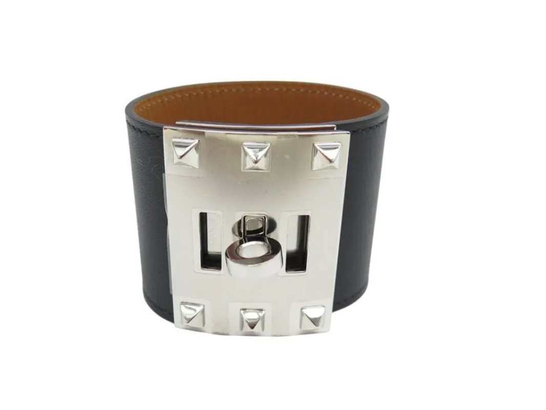 bracelet HERMES extreme kelly dog manchette en cuir noir 50mm sold by 58 Facettes