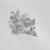 Magnifique broche en or blanc 18K (750 millièmes) issue de la transformation d’un diadème en or blanc et diamants sold by 58 Facettes