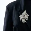 Magnifique broche en or blanc 18K (750 millièmes) issue de la transformation d’un diadème en or blanc et diamants sold by 58 Facettes