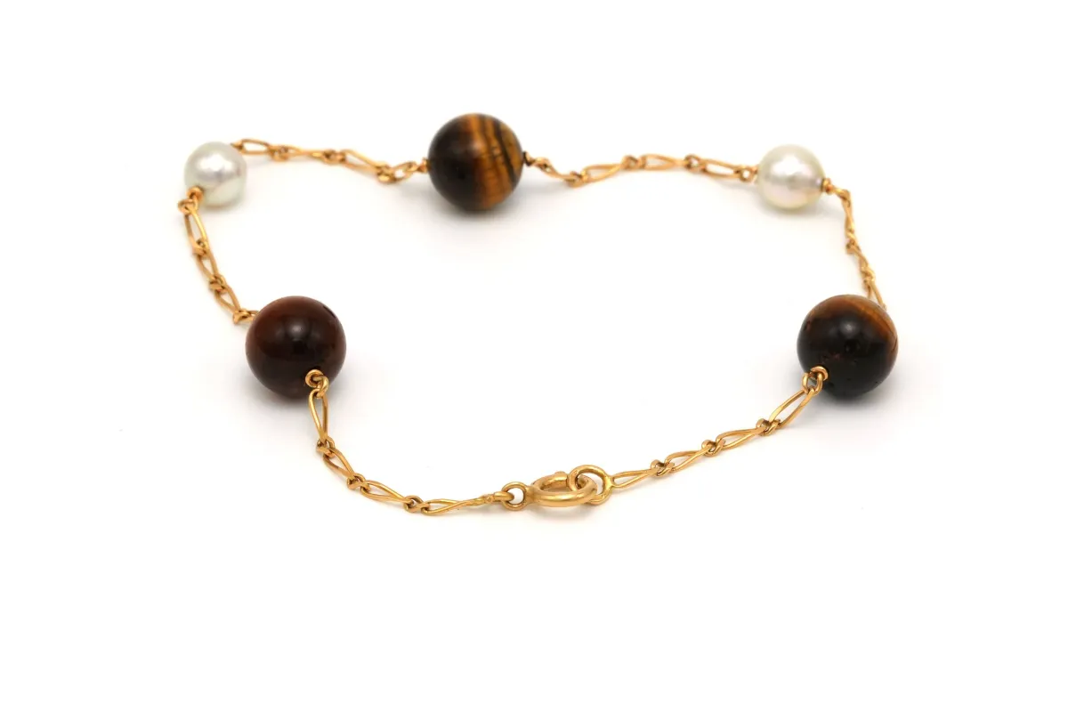 Bracelet contemporain en or jaune, perles et œil de tigre sold by 58 Facettes