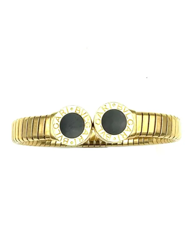 BVLGARI. Collection "Tubogas", bracelet or jaune et onyx sold by 58 Facettes