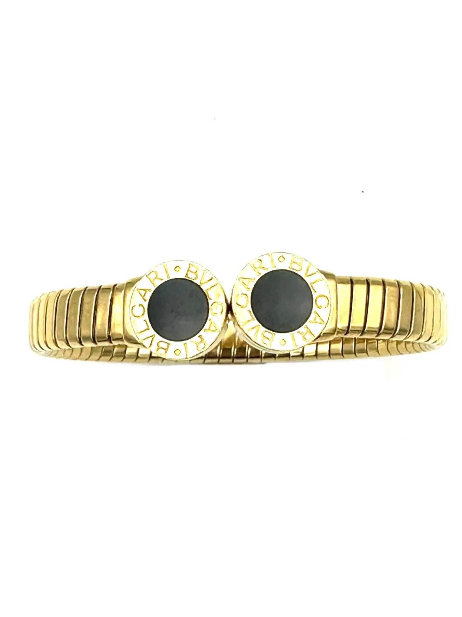 BVLGARI. Collection "Tubogas", bracelet or jaune et onyx sold by 58 Facettes