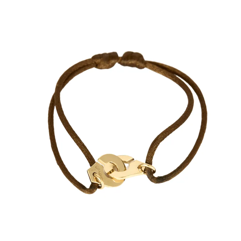 DINH VAN - R10 - Bracelet menottes en or jaune et cordon de soie sold by 58 Facettes