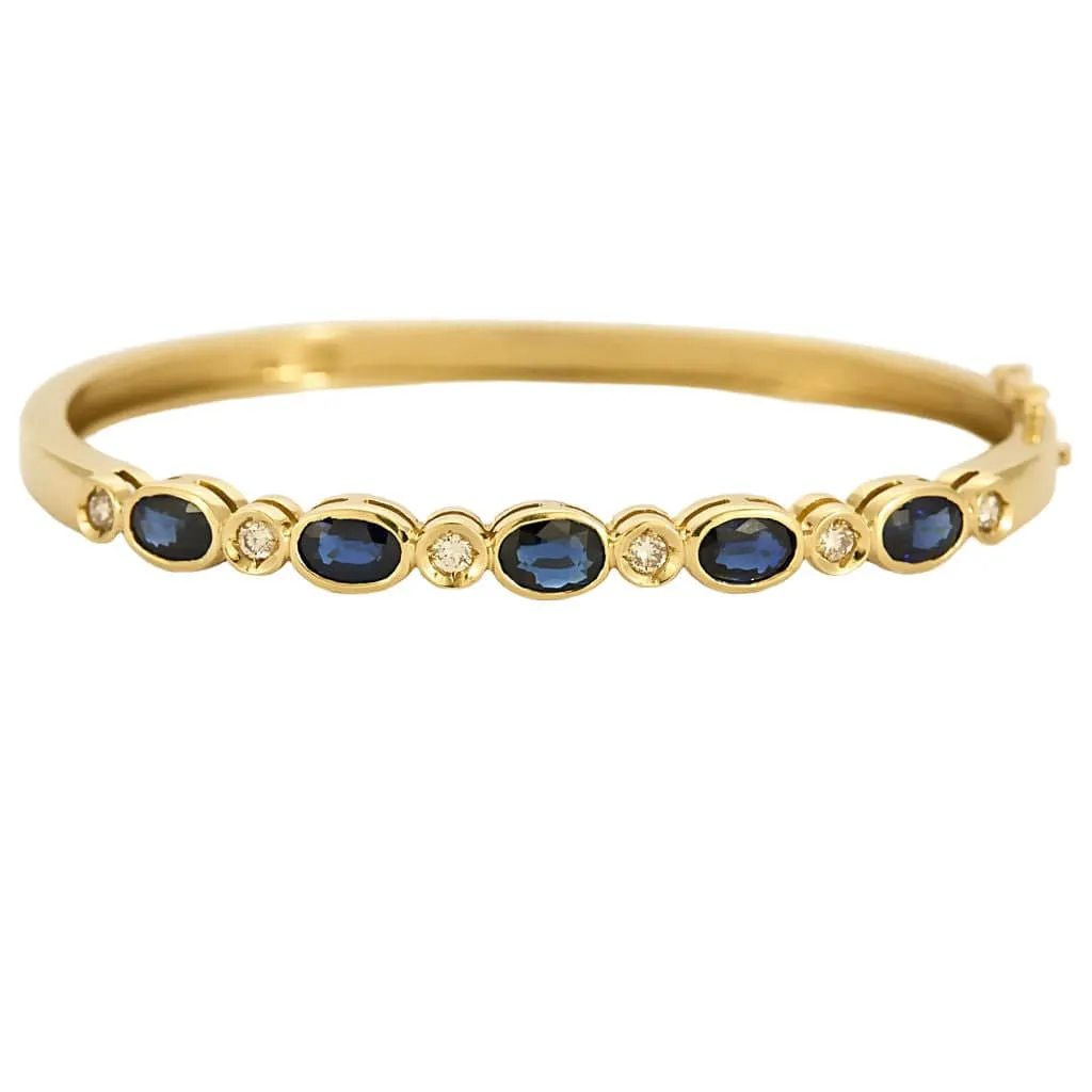 Bracelet jonc en or jaune, diamants et saphirs sold by 58 Facettes