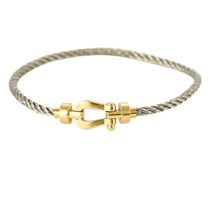 FRED - Force 10 - Bracelet en or jaune et cordon en acier sold by 58 Facettes