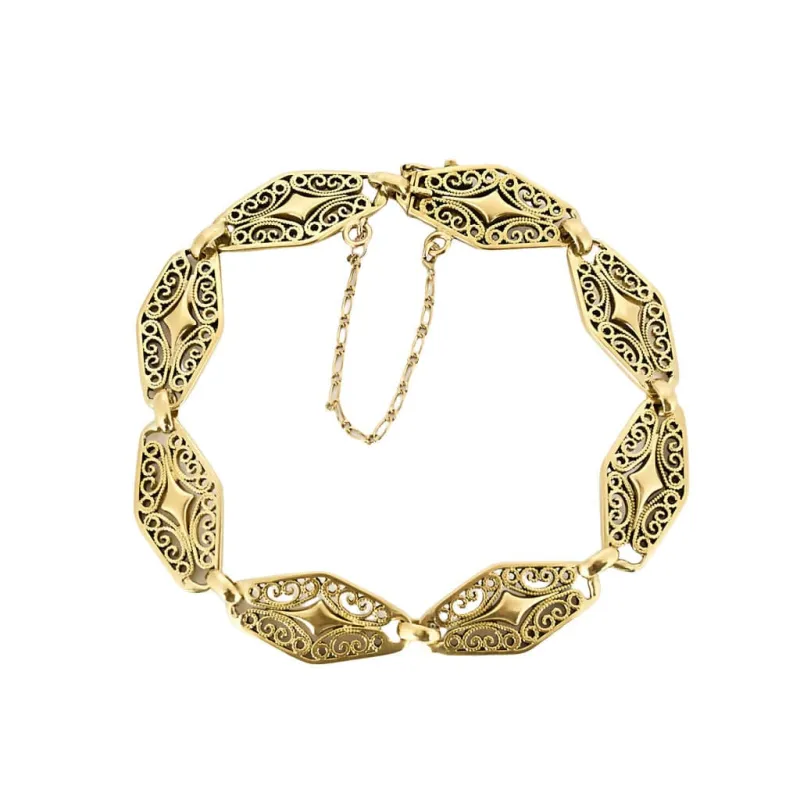 Bracelet en or jaune ciselé et ajouré à motif de volutes sold by 58 Facettes