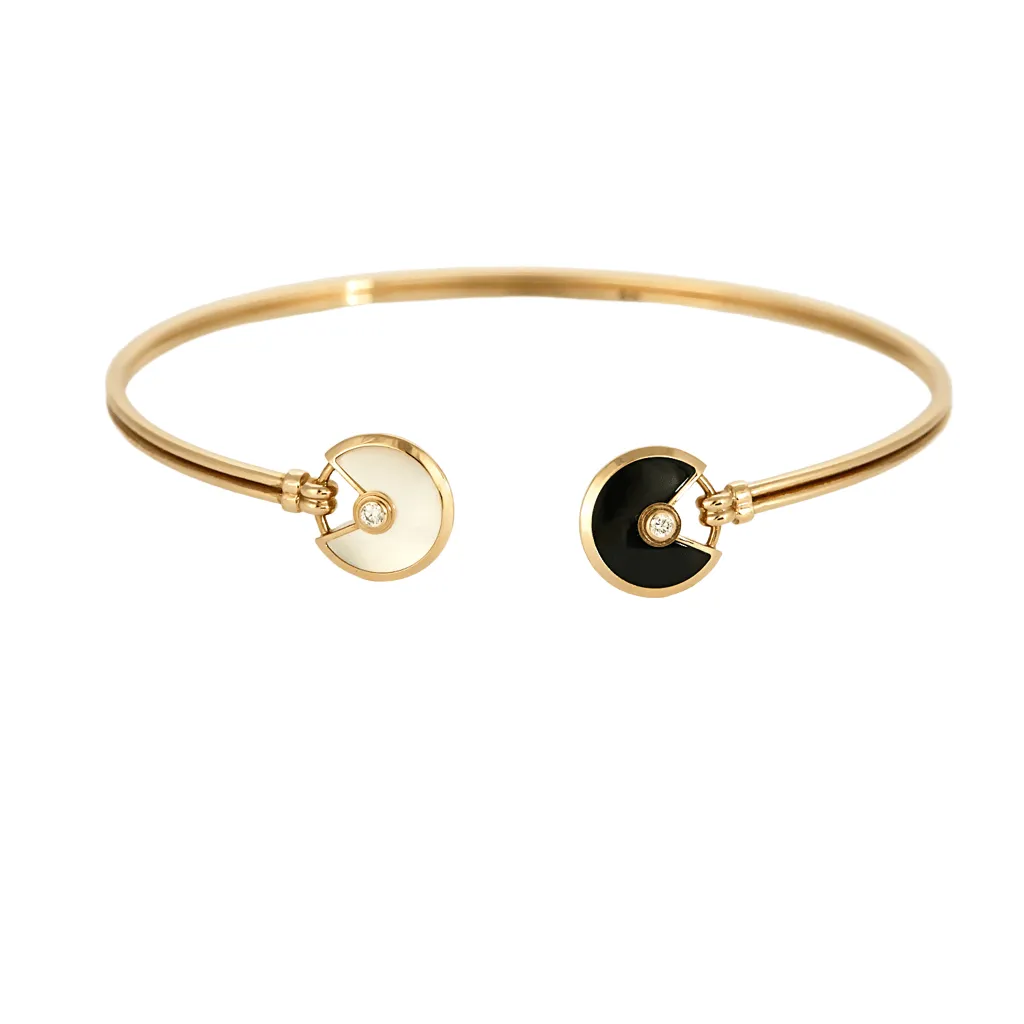 CARTIER - Amulette - Bracelet jonc ouvert en or rose, onyx, nacre et diamants sold by 58 Facettes