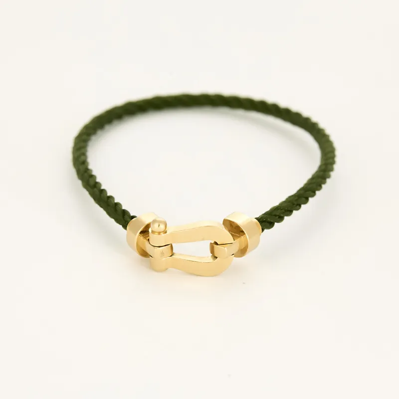FRED - FORCE 10 - Moyen modèle - Bracelet en or jaune et cordon torsadé en acier vert sold by 58 Facettes