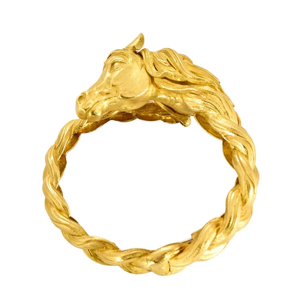 HERMES - Bracelet jonc vintage en or jaune a motif de cheval sold by 58 Facettes