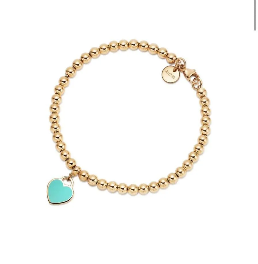 Tiffany&Co - Bracelet de perles Heart Tag en or jaune sold by 58 Facettes