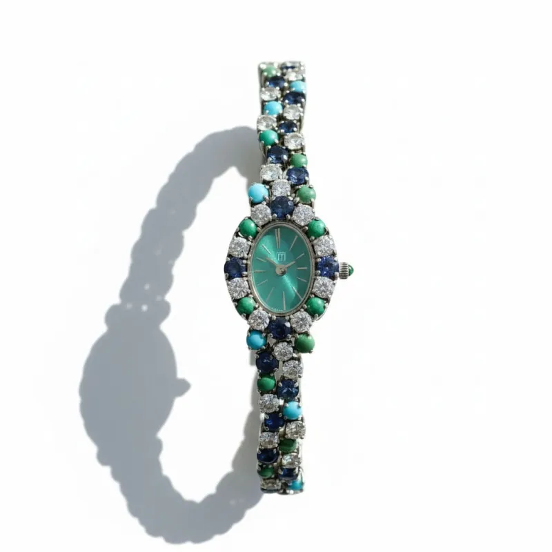 Uti - Montre Ovale - Or Blanc - Diamants, Saphirs et Turquoise sold by 58 Facettes