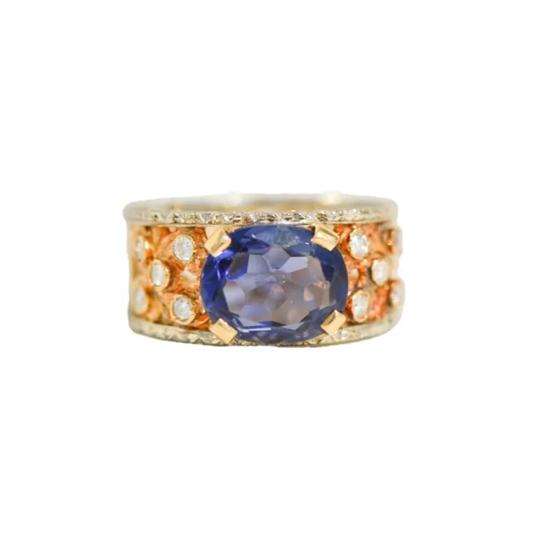 Bague cocktail exclusive en or jaune et blanc 18 carats, ornée de tanzanite et de diamants – un pur chef-d'œuvre d'orfèvrerie sold by 58 Facettes