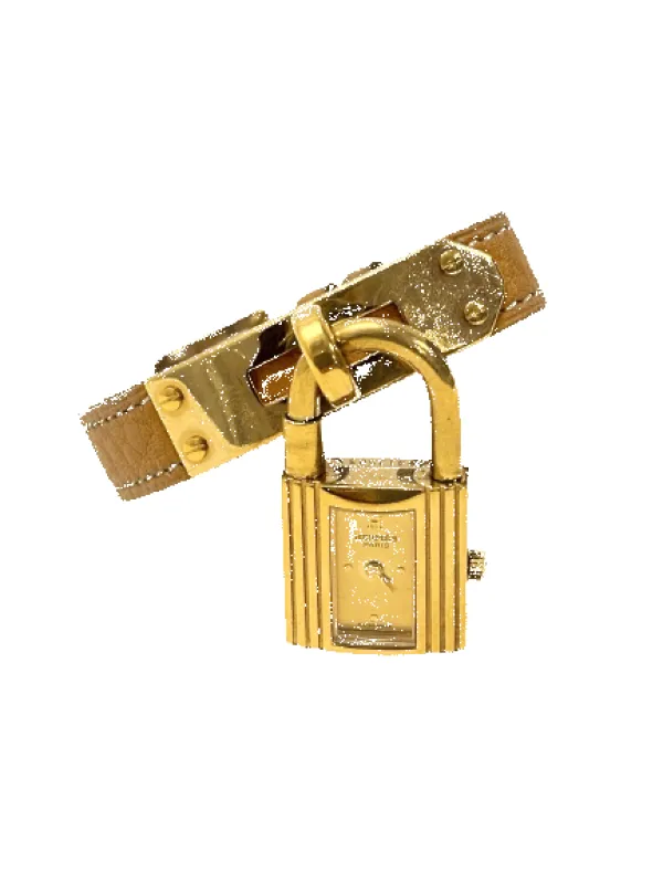 Hermès - Montre Kelly en plaqué or, bracelet cuir camel sold by 58 Facettes