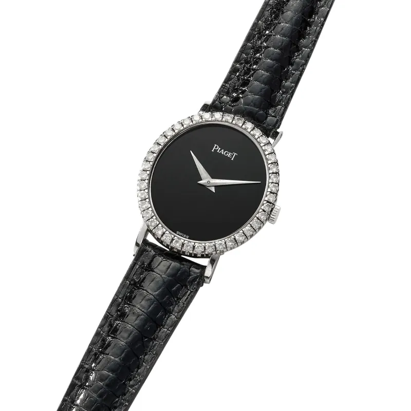 PIAGET - Montre en or blanc, onyx et diamants sold by 58 Facettes