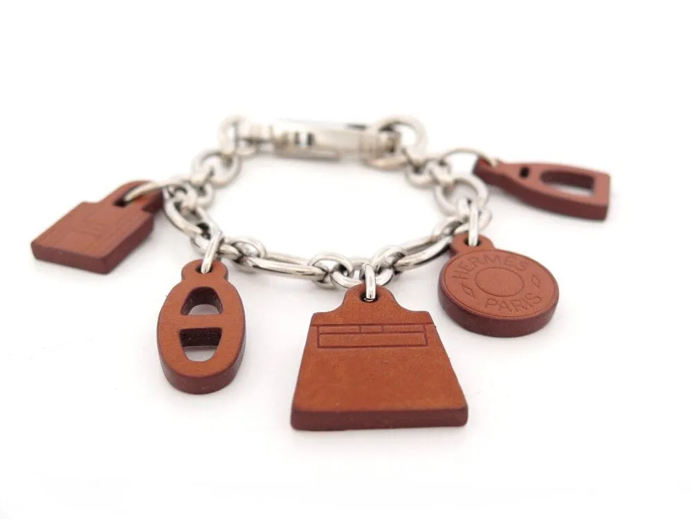 bracelet HERMES olga amulette a01032 18 cuir barenia acier sold by 58 Facettes product image thumbnail 2