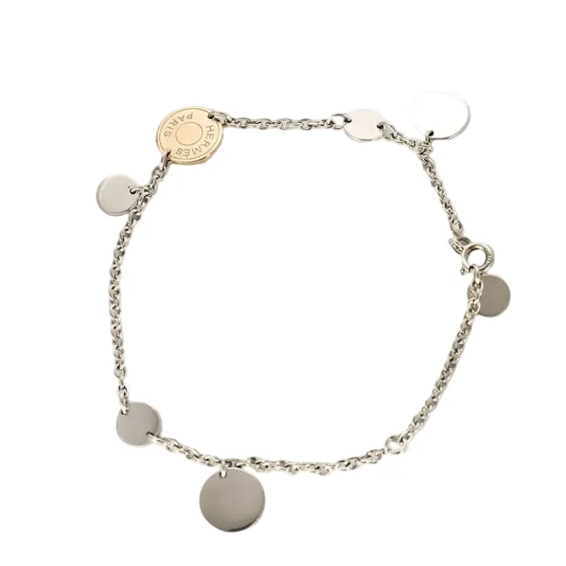 Hermès - Ex Libris - Bracelet en argent et or rose . sold by 58 Facettes