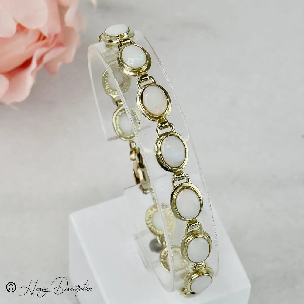 Bracelet vintage en or jaune 14 carats et opales sold by 58 Facettes product image thumbnail 4