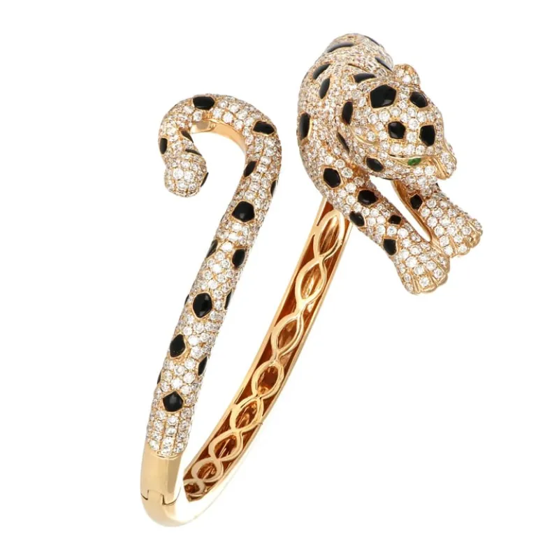 Bracelet panthère figuratif en or jaune 18 carats, onyx, émeraudes et diamants sold by 58 Facettes