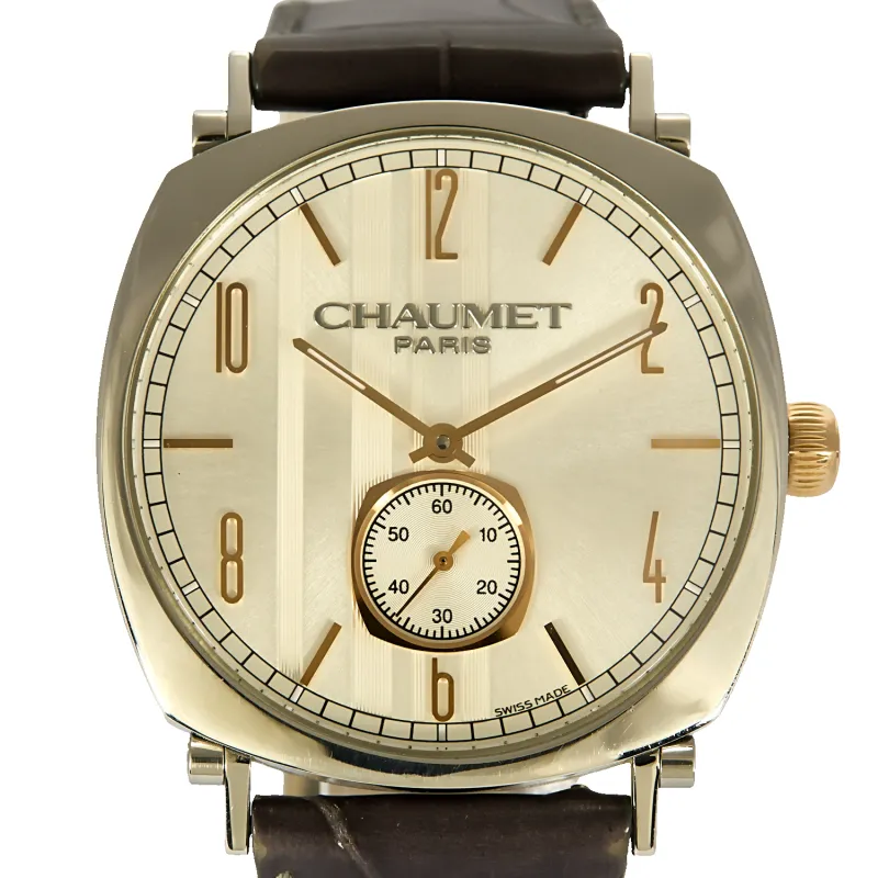 CHAUMET - DANDY - Montre en acier, acier doré à boitier tonneau et à mouvement mécanique made by 58 Facettes