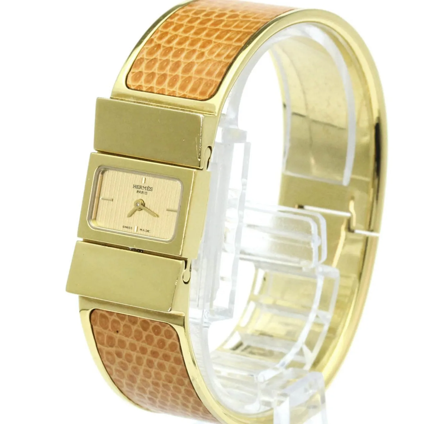 Hermès Loquet - Montre quartz plaquée or et lézard sold by 58 Facettes