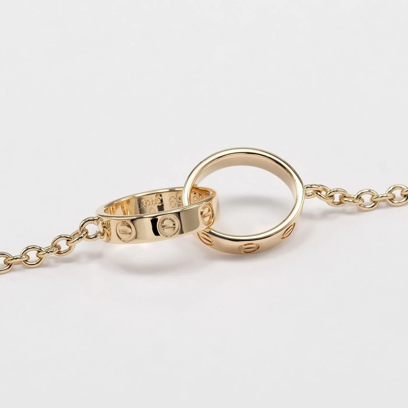 Cartier Love Interlocking - Bracelet en or jaune 18K sold by 58 Facettes product image thumbnail 3