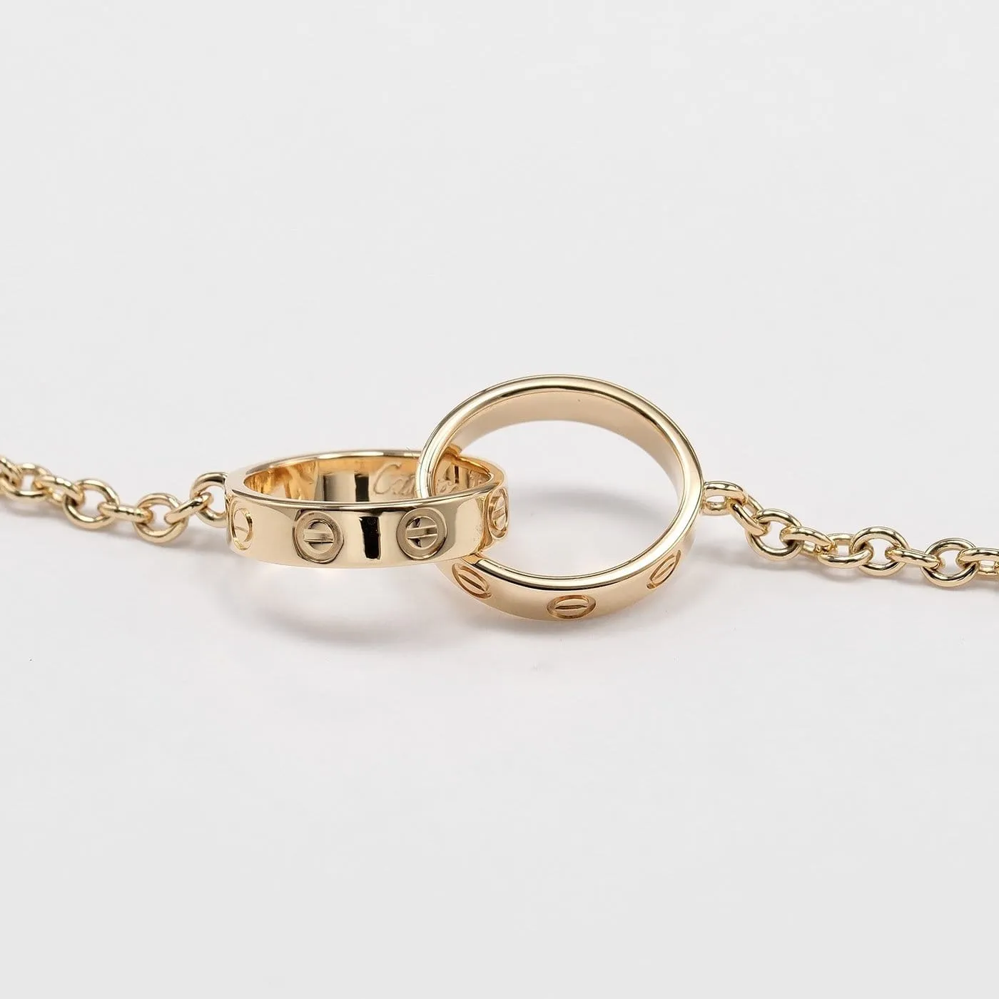 Cartier Love Interlocking - Bracelet en or jaune 18K sold by 58 Facettes product image thumbnail 4