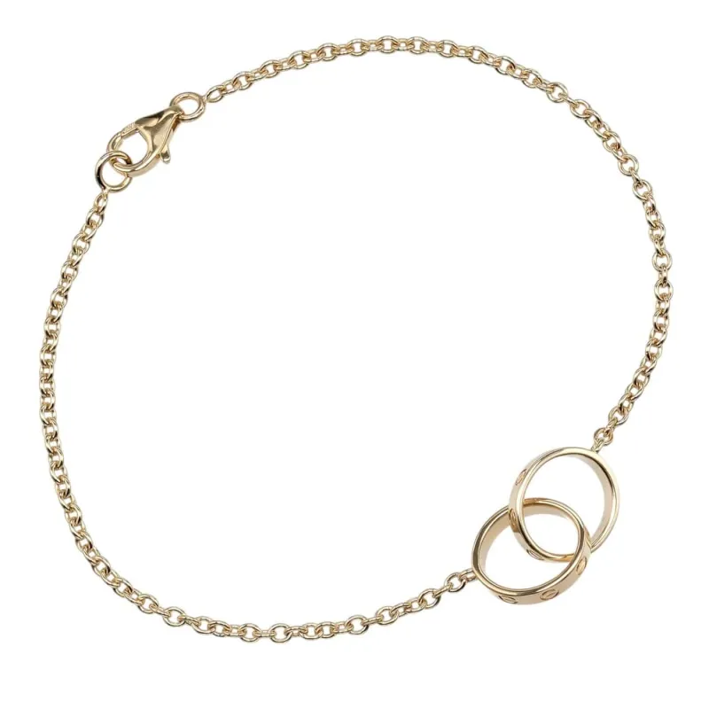 Cartier Love Interlocking - Bracelet en or jaune 18K made by 58 Facettes
