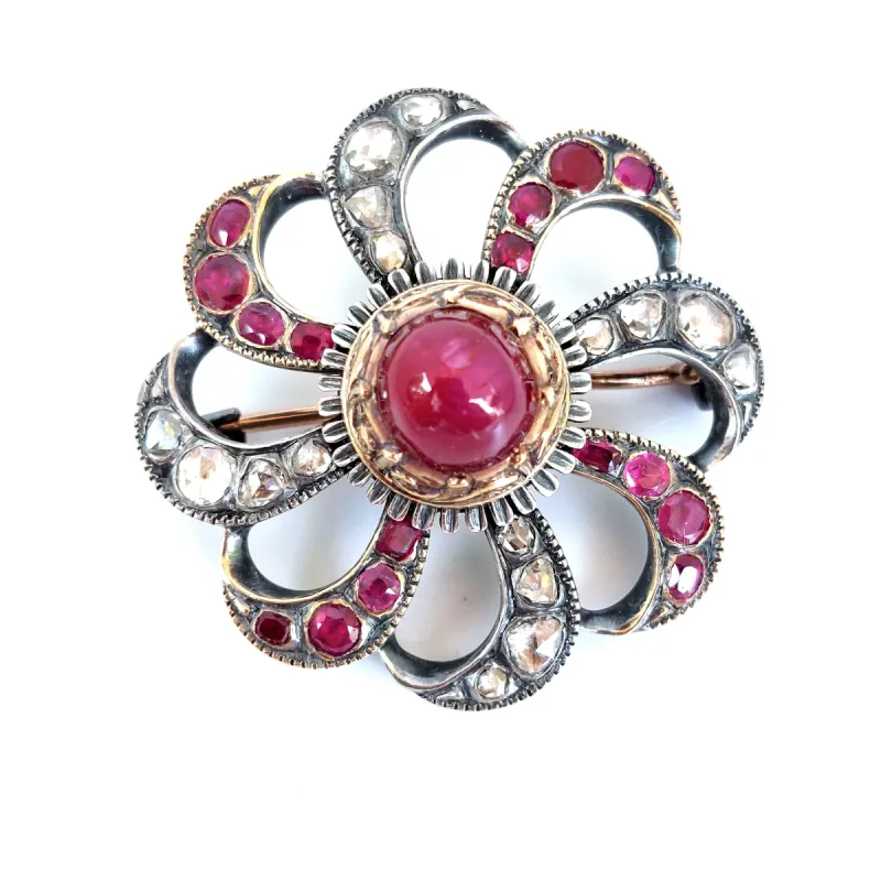 Broche tourbillonnante 19ème siècle rubis étoilé diamants sold by 58 Facettes