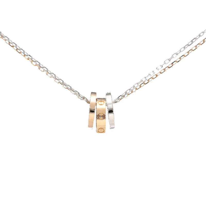 CARTIER - Collier pendentif Love diamants en or rose et gris sold by 58 Facettes