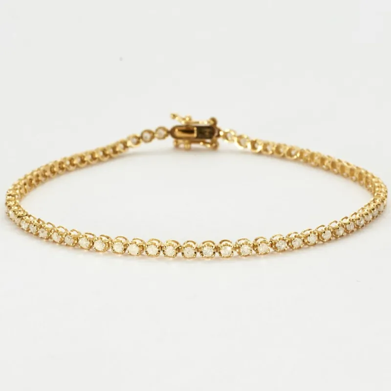 Bracelet tenis en or jaune et diamants. sold by 58 Facettes
