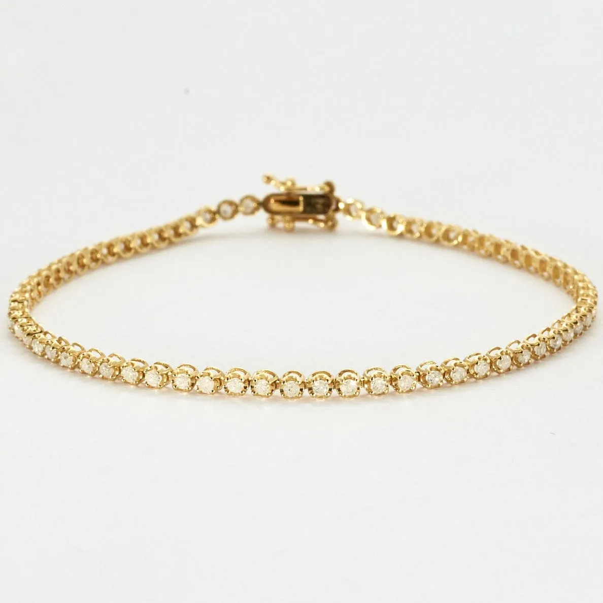 Bracelet tenis en or jaune et diamants. sold by 58 Facettes