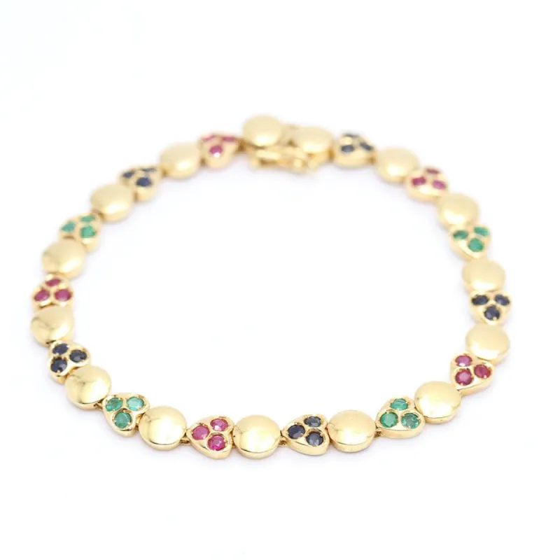 Bracelet coeurs, rubis, saphirs et émeraudes en or jaune sold by 58 Facettes
