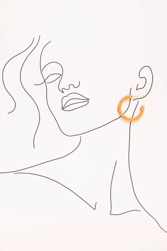 Beaded Hoops in Tangerine sold by Adrift